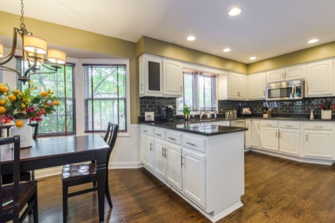 737 West Bauer Road Naperville, IL 60563 - Photo 8 of 25 a kitchen with stainless steel appliances granite countertop a stove a sink a microwave a dining table and chairs