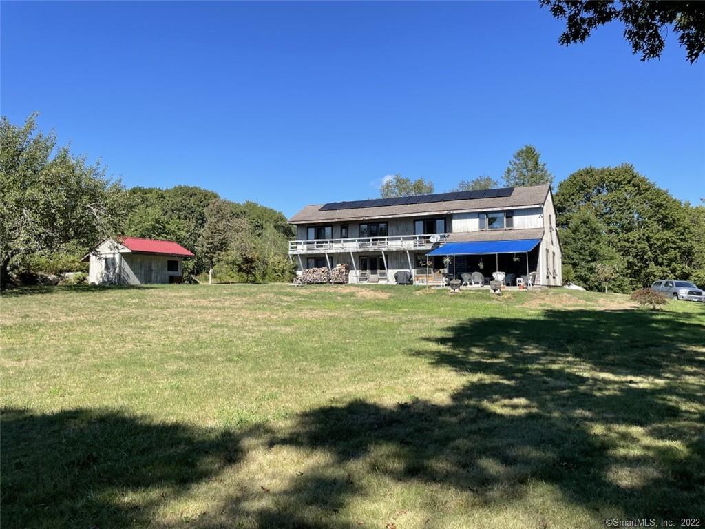 73 Lords Hill Road Stonington, CT 06378 - Photo 1 of 1 Rear View of the 4-5 bedroom house