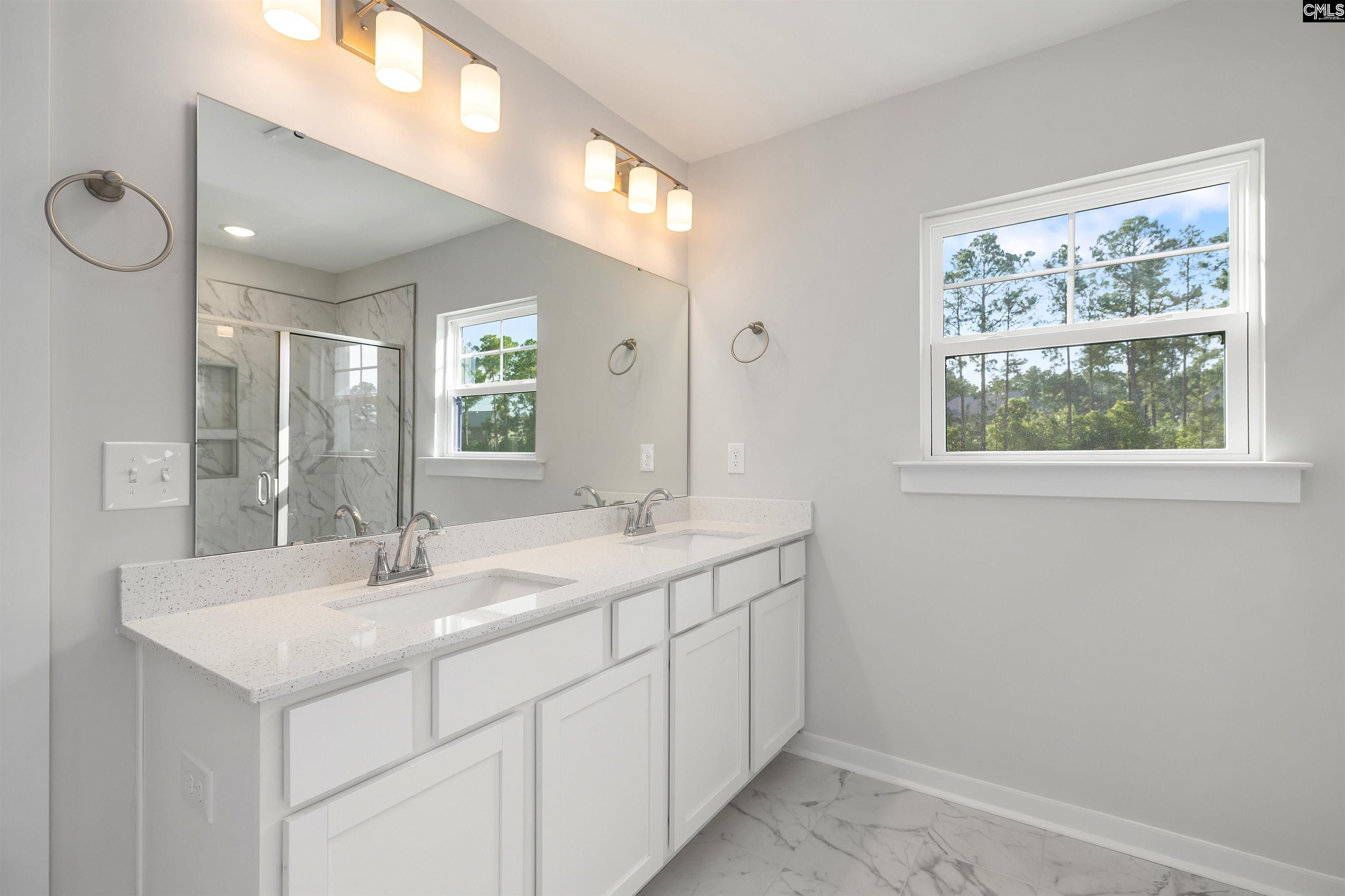 32 Fawn Spot Court Elgin, SC 29045 - Photo 19 of 28 a bathroom with a sink and a mirror