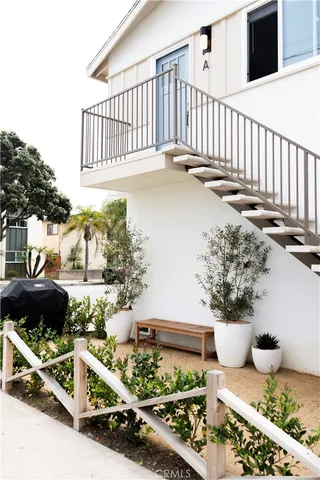 a living room with furniture a lamp and a chandelier