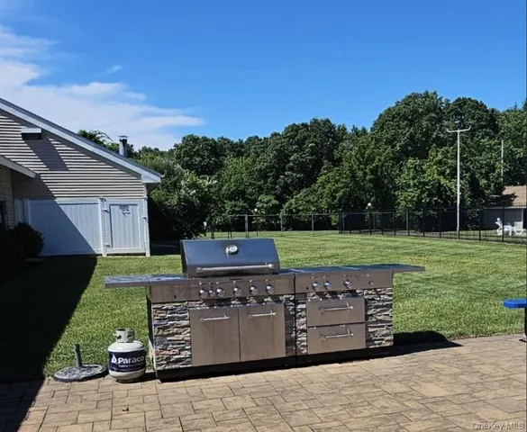 a view of a garden with wooden fence
