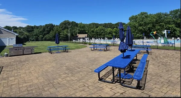 a view of a backyard with sitting area