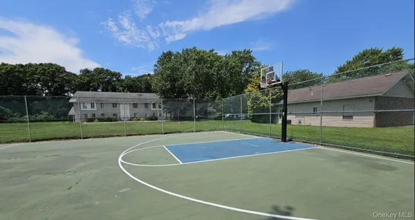 a living room with furniture and large windows