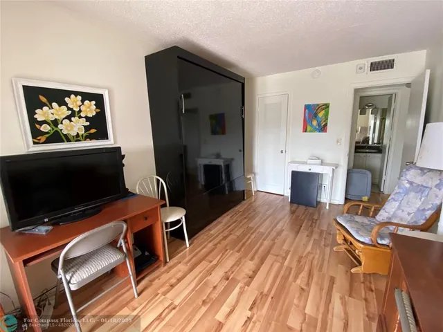 a lake view with a garden and outdoor seating