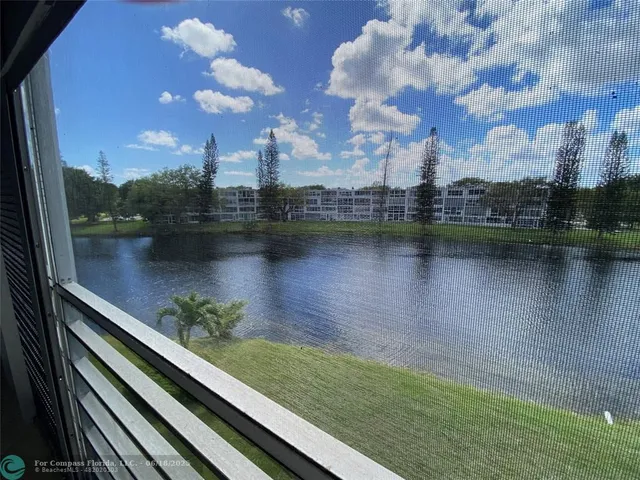 a view of a golf course with a lake