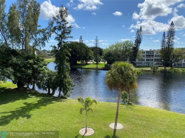 a view of livingroom with furniture and floor to ceiling window