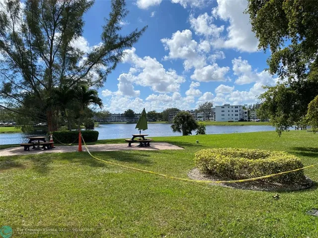 a view of swimming pool with outdoor seating and yard