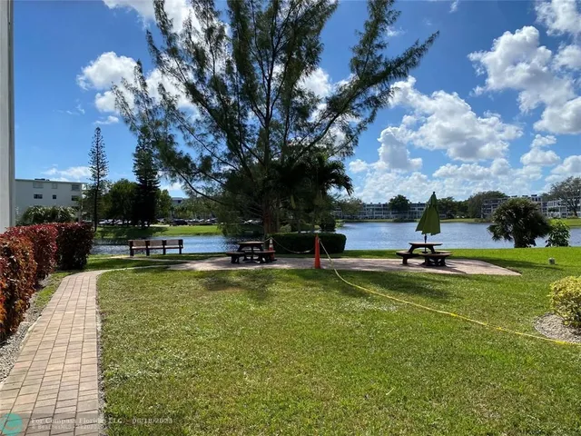 a view of a swimming pool with an outdoor space and seating area