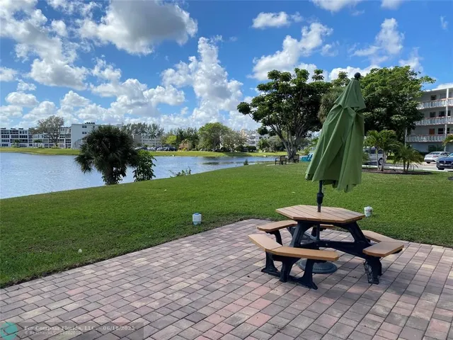a view of swimming pool with a table and chairs