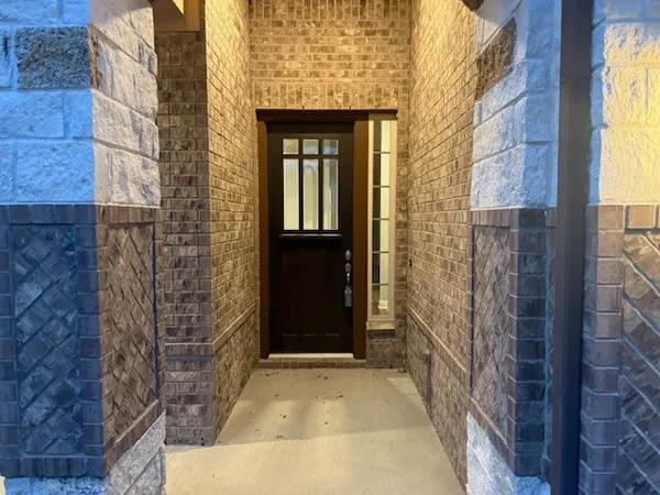 a view of a brick house with a door