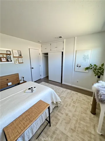 a bedroom with a bed and a cabinets