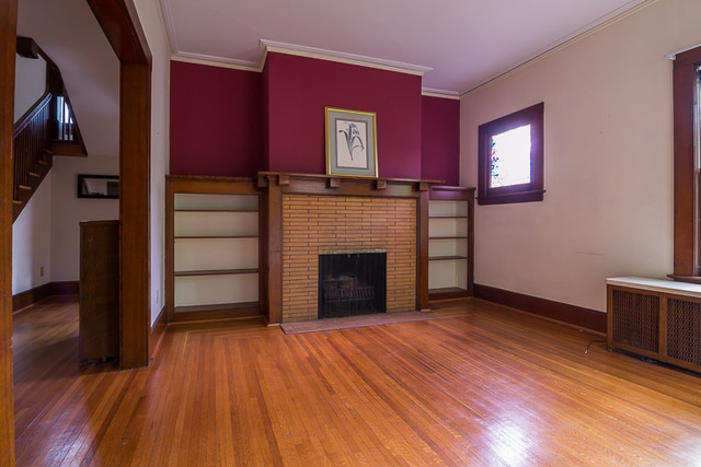 715 North Spring Street Elgin, IL 60120 - Photo 4 of 18 a view of a livingroom with wooden floor and a fireplace