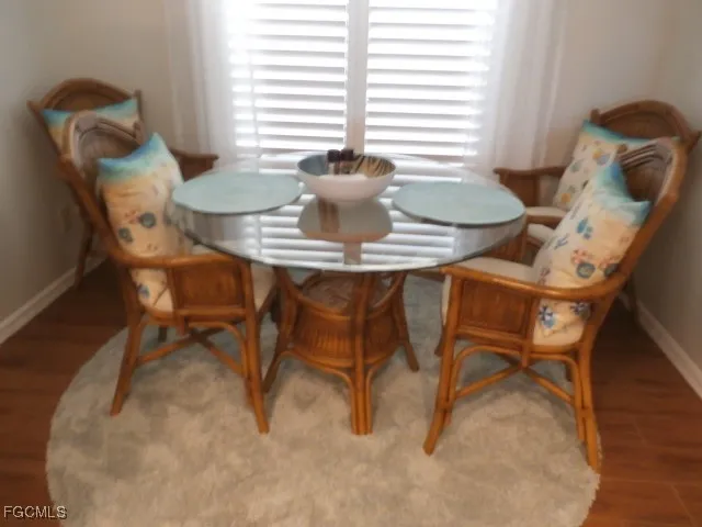 a dining room with furniture and window