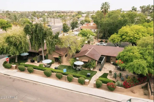 an aerial view of house with yard
