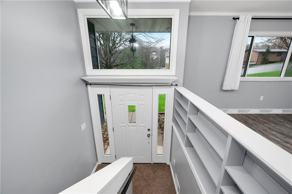 241 La Ray Drive Butler, PA 16001 - Photo 16 of 34 a view of a hallway with wooden floor and staircase