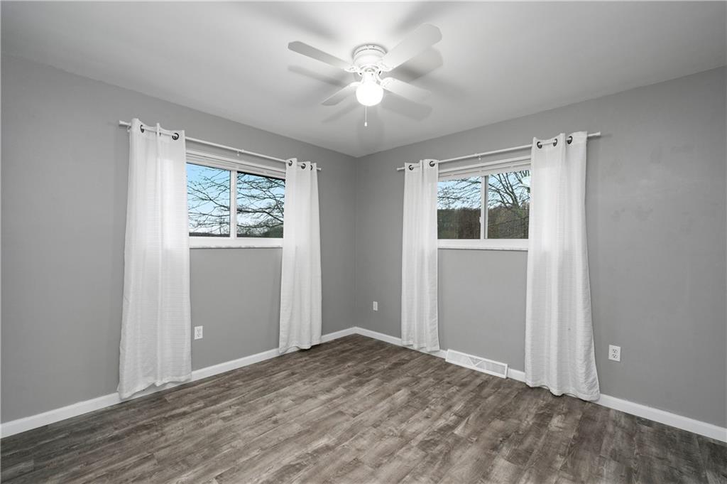 241 La Ray Drive Butler, PA 16001 - Photo 22 of 34 wooden floor in an empty room with a window