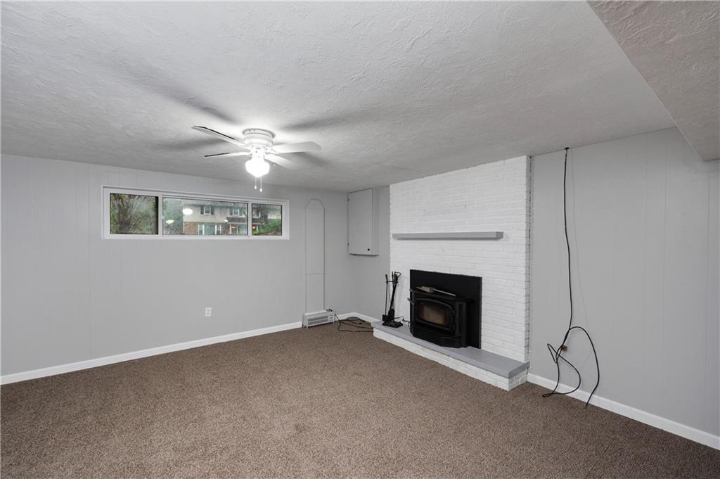 241 La Ray Drive Butler, PA 16001 - Photo 25 of 34 wooden floor fireplace and windows in an empty room
