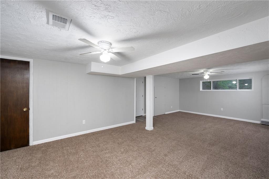 241 La Ray Drive Butler, PA 16001 - Photo 27 of 34 an empty room with chandelier fan and windows