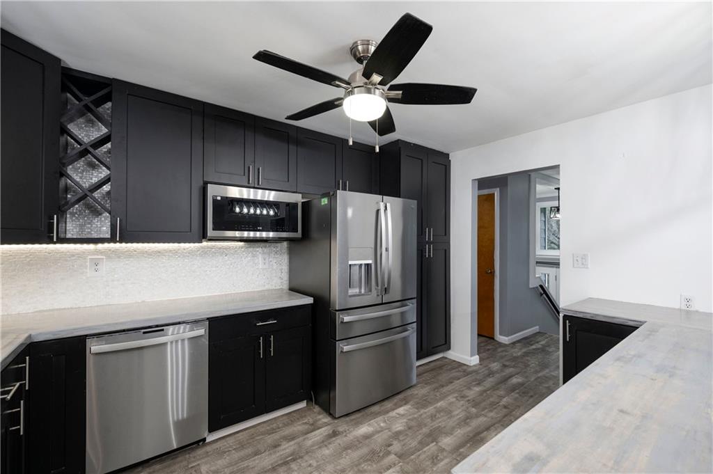 241 La Ray Drive Butler, PA 16001 - Photo 4 of 34 a kitchen with stainless steel appliances kitchen island granite countertop a refrigerator a sink and a stove