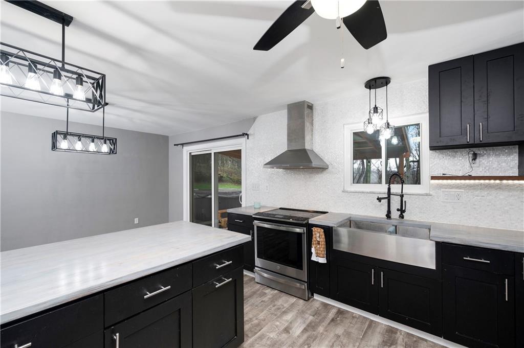 241 La Ray Drive Butler, PA 16001 - Photo 6 of 34 a kitchen with stainless steel appliances a sink stove and cabinets