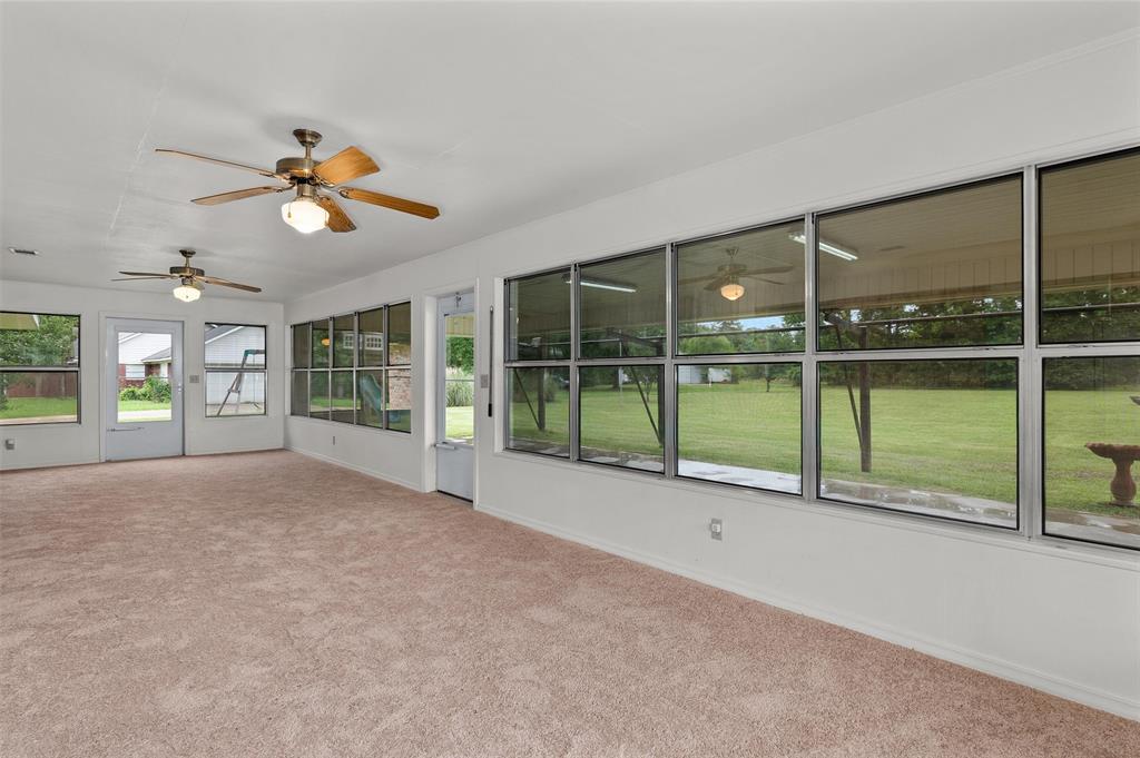 927 Stonewall-Preston Road Stonewall, LA 71078 - Photo 16 of 28 a view of an empty room with a sliding door