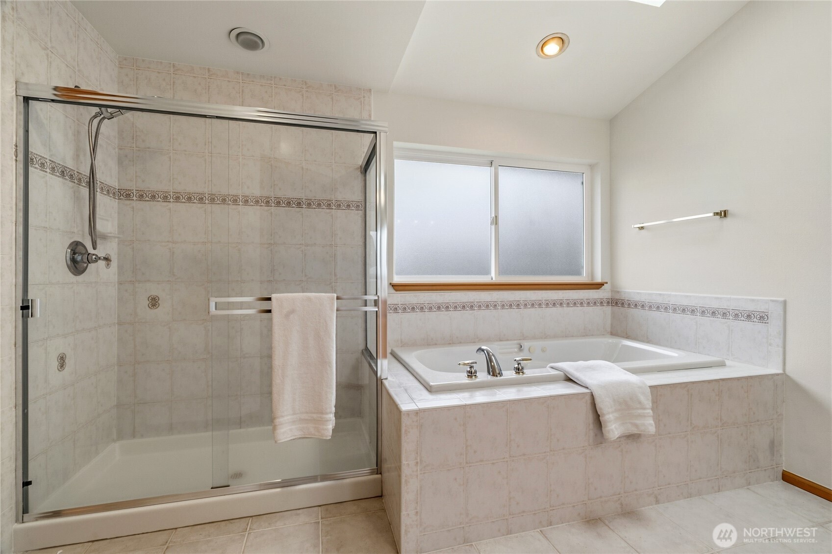 18639 175th Avenue Southeast Renton, WA 98058 - Photo 27 of 37 a bathroom with a bathtub and a sink