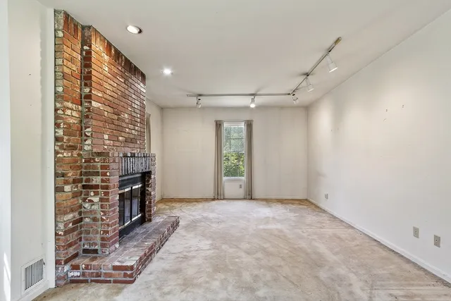 a view of livingroom with window and fireplace