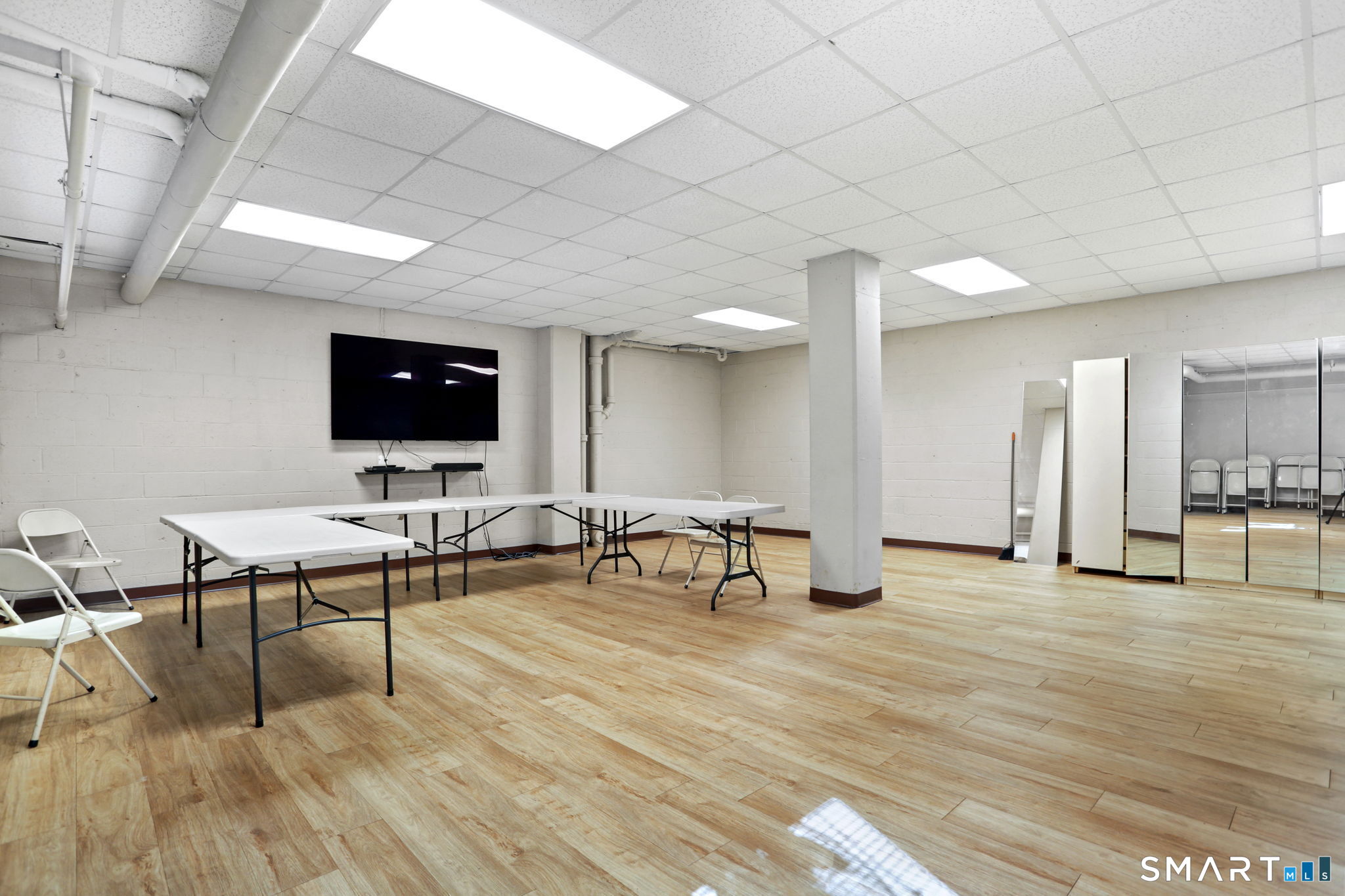 25 Cartright Street, Unit 3K Bridgeport, CT 06604 - Photo 17 of 18 a view of a livingroom with chairs