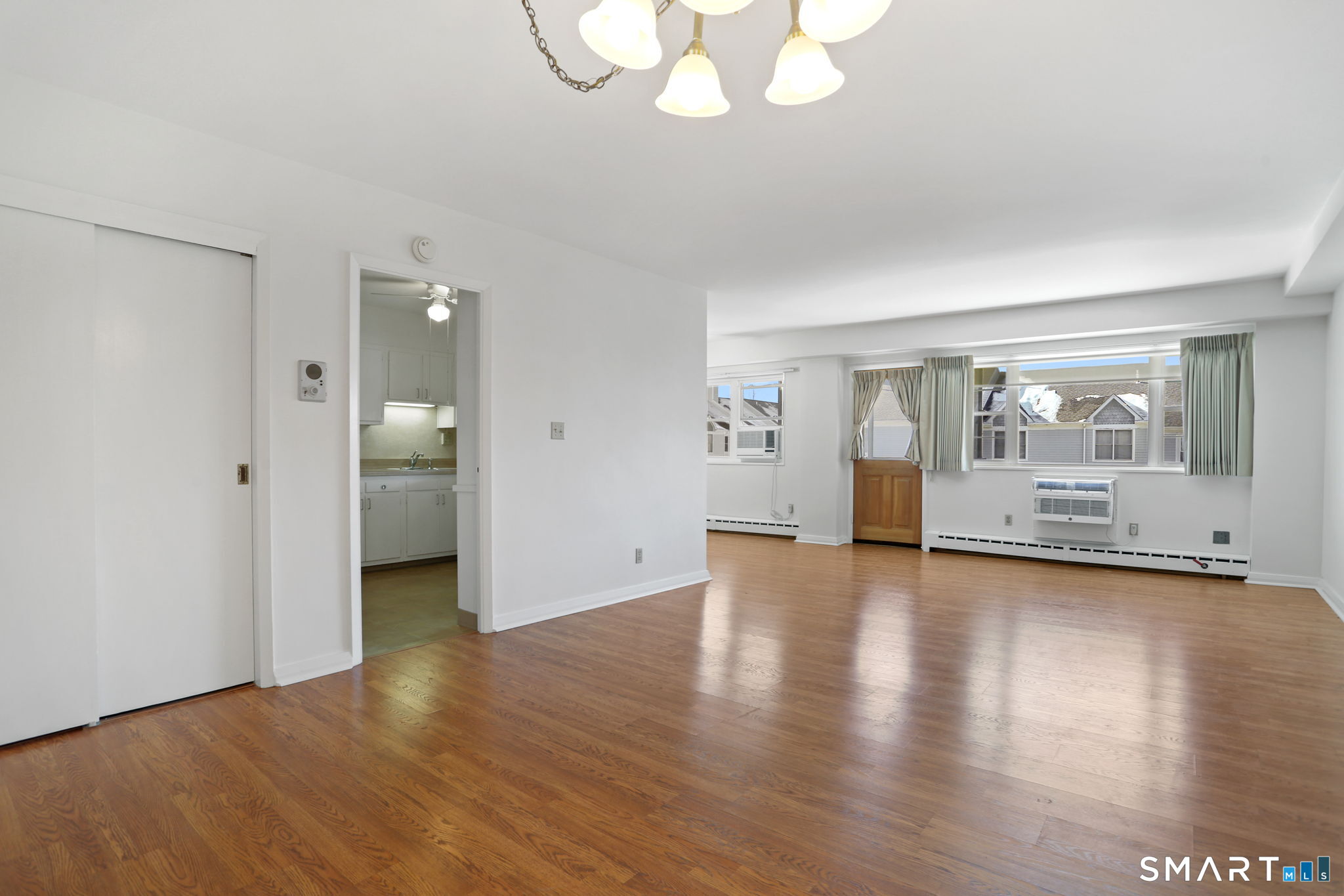 25 Cartright Street, Unit 3K Bridgeport, CT 06604 - Photo 2 of 18 a view of a room with wooden floor and window