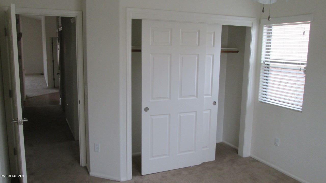 10855 East New Rock Ridge Drive Vail, AZ 85641 - Photo 23 of 34 a view of a hallway with closet area