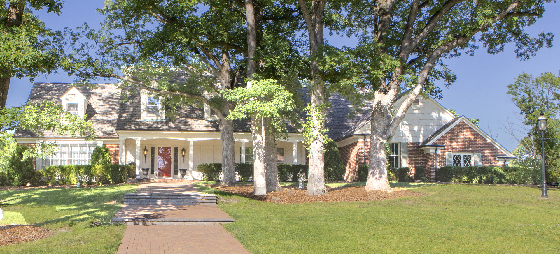 front view of a building with a yard