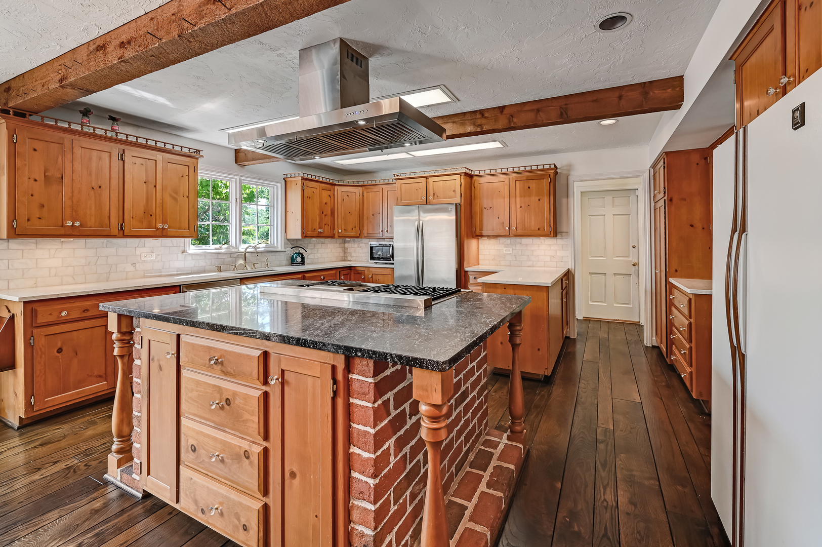 8857 Johnston Road Burr Ridge, IL 60527 - Photo 14 of 47 a kitchen with granite countertop a sink appliances cabinets and a large window