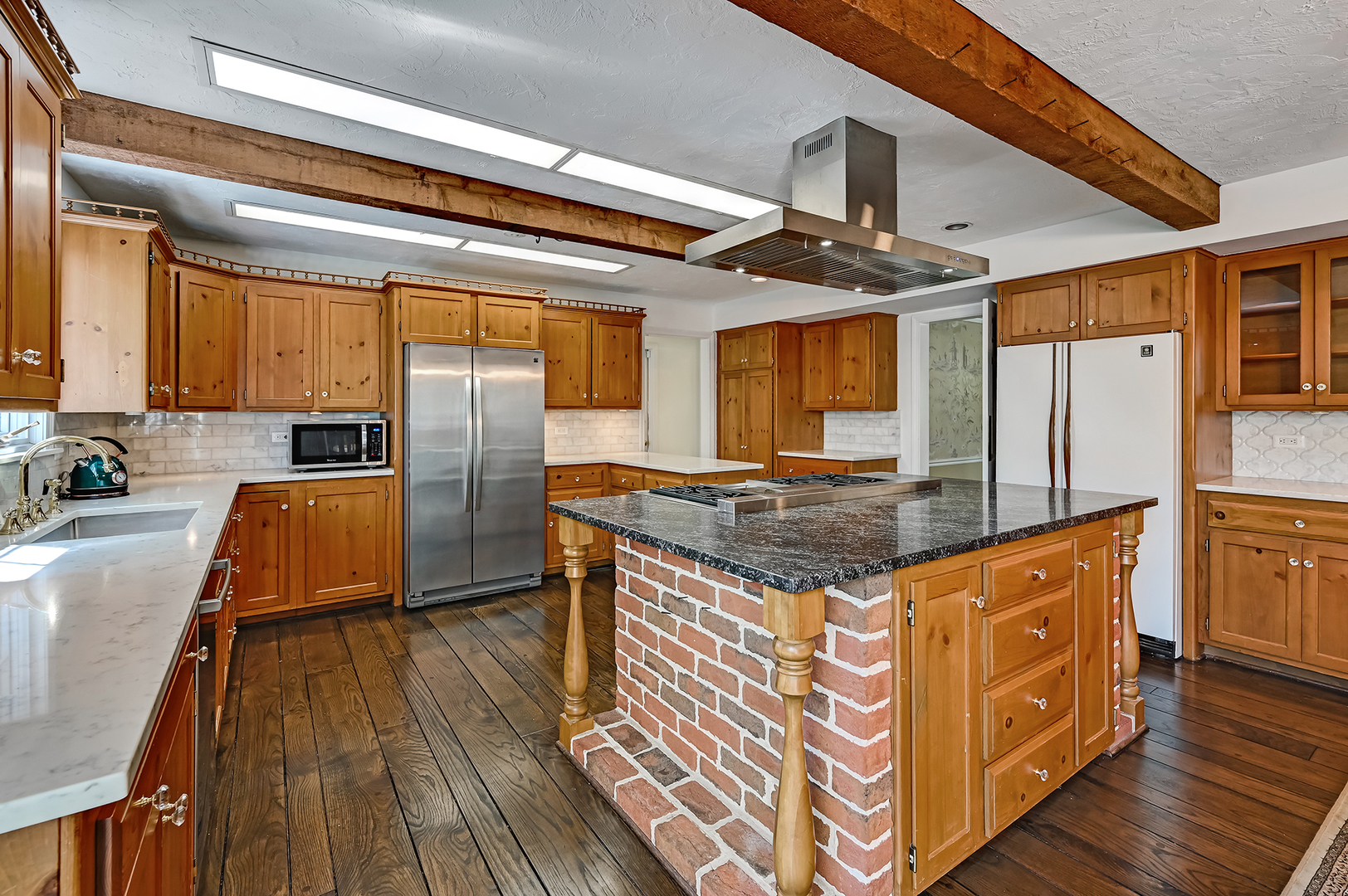 8857 Johnston Road Burr Ridge, IL 60527 - Photo 15 of 47 a kitchen with stainless steel appliances granite countertop a sink a stove and a wooden floors