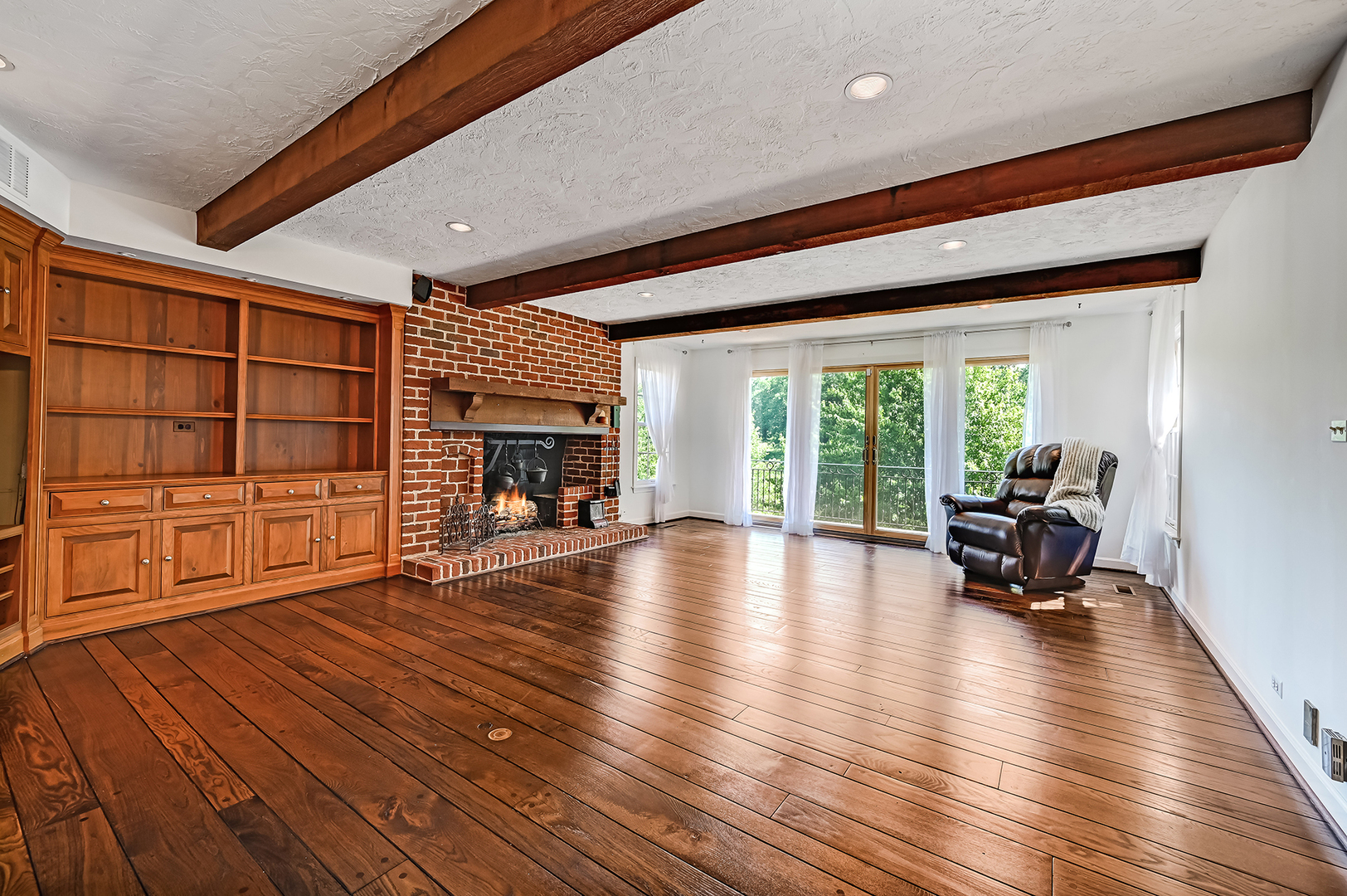 8857 Johnston Road Burr Ridge, IL 60527 - Photo 17 of 47 a living room with furniture and a fireplace