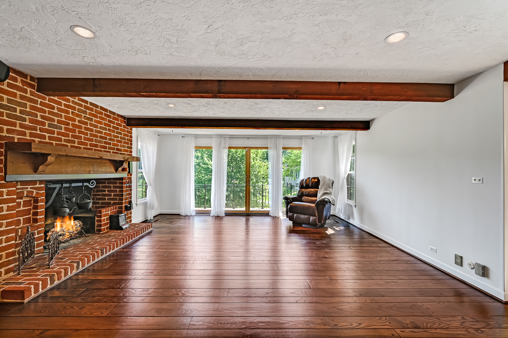 8857 Johnston Road Burr Ridge, IL 60527 - Photo 18 of 47 a living room with furniture and a fireplace
