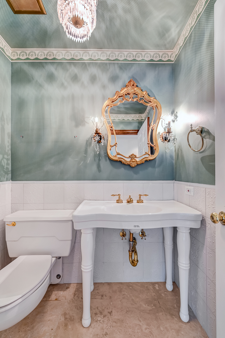 8857 Johnston Road Burr Ridge, IL 60527 - Photo 20 of 47 a bathroom with a sink and a mirror
