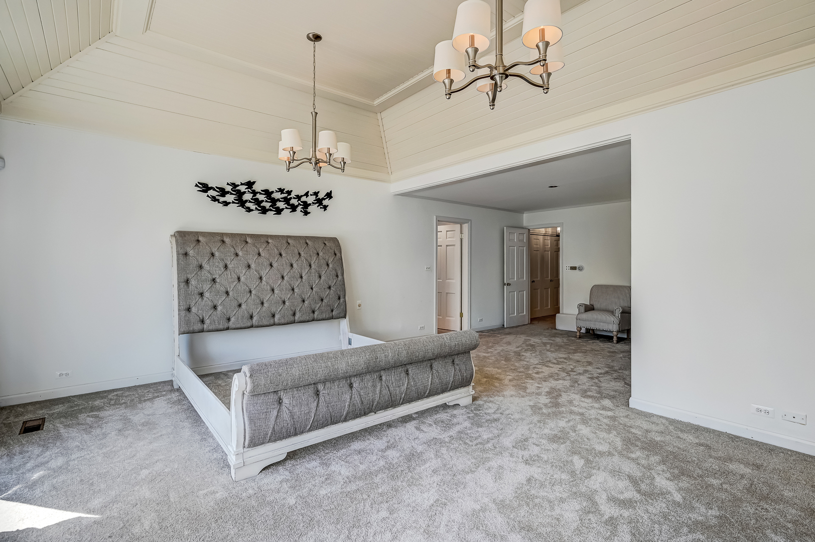 8857 Johnston Road Burr Ridge, IL 60527 - Photo 24 of 47 a living room with furniture and a chandelier
