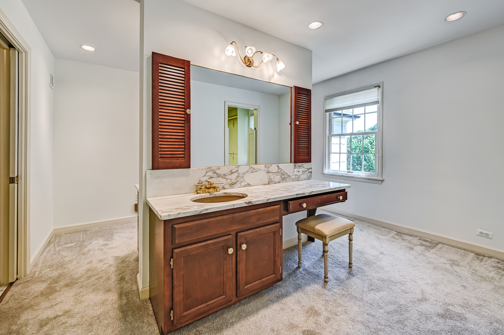 8857 Johnston Road Burr Ridge, IL 60527 - Photo 28 of 47 a bathroom with a sink and a mirror