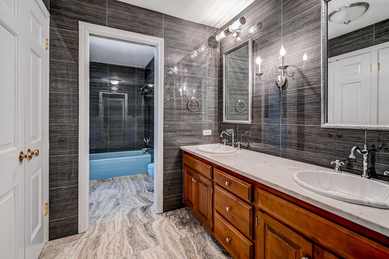 8857 Johnston Road Burr Ridge, IL 60527 - Photo 30 of 47 a bathroom with a sink double vanity and a shower