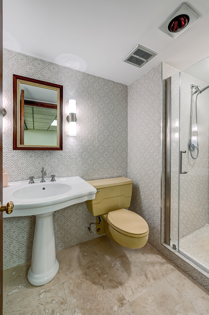 8857 Johnston Road Burr Ridge, IL 60527 - Photo 40 of 47 a bathroom with a toilet sink and mirror