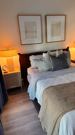 a bedroom with a bed and window