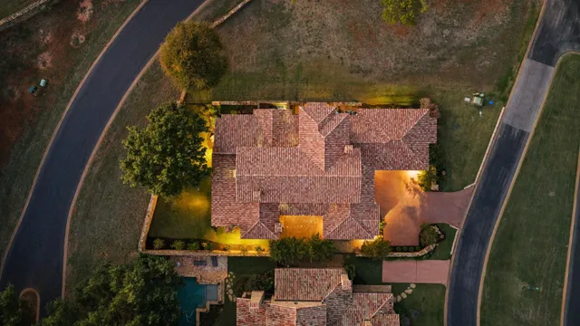 an aerial view of a house with a yard