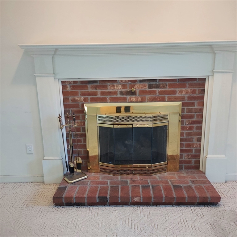 43 Barque Circle Dennis, MA 02660 - Photo 11 of 42 a fireplace with sitting on top