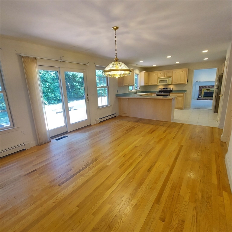 43 Barque Circle Dennis, MA 02660 - Photo 14 of 42 a view of a kitchen with wooden floor and a window