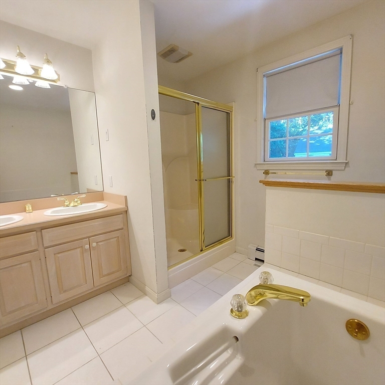 43 Barque Circle Dennis, MA 02660 - Photo 23 of 42 a bathroom with a tub sink and mirror