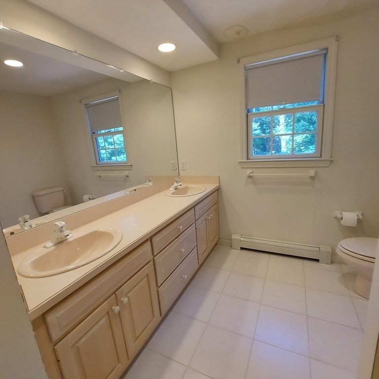 43 Barque Circle Dennis, MA 02660 - Photo 24 of 42 a bathroom with a sink a toilet and a mirror