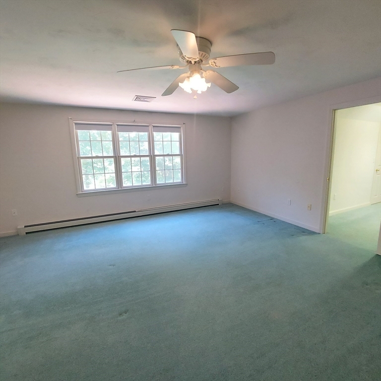 43 Barque Circle Dennis, MA 02660 - Photo 26 of 42 an empty room with a window and a ceiling fan