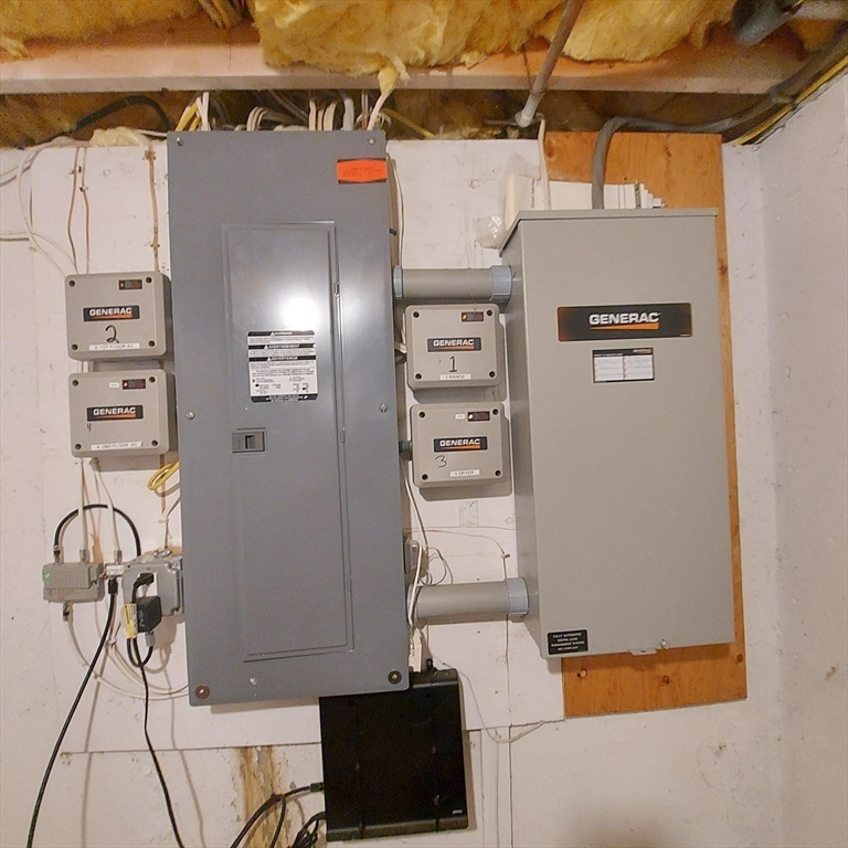 43 Barque Circle Dennis, MA 02660 - Photo 39 of 42 a view of storage and utility room with racks on the wall