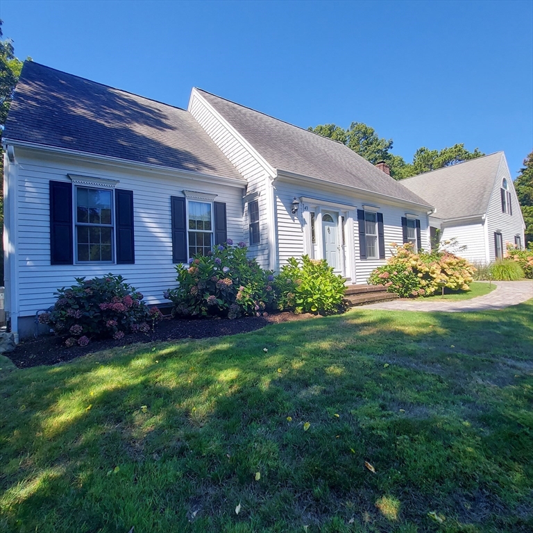 43 Barque Circle Dennis, MA 02660 - Photo 6 of 42 a front view of house with yard and green space
