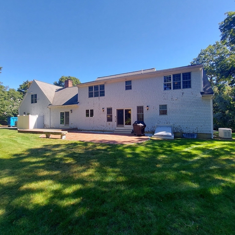 43 Barque Circle Dennis, MA 02660 - Photo 7 of 42 a front view of house with yard and green space